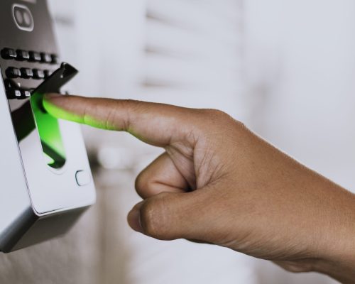 Scanning finger on a coronavirus contaminated fingerprint access control Scanning finger on a coronavirus contaminated fingerprint access control